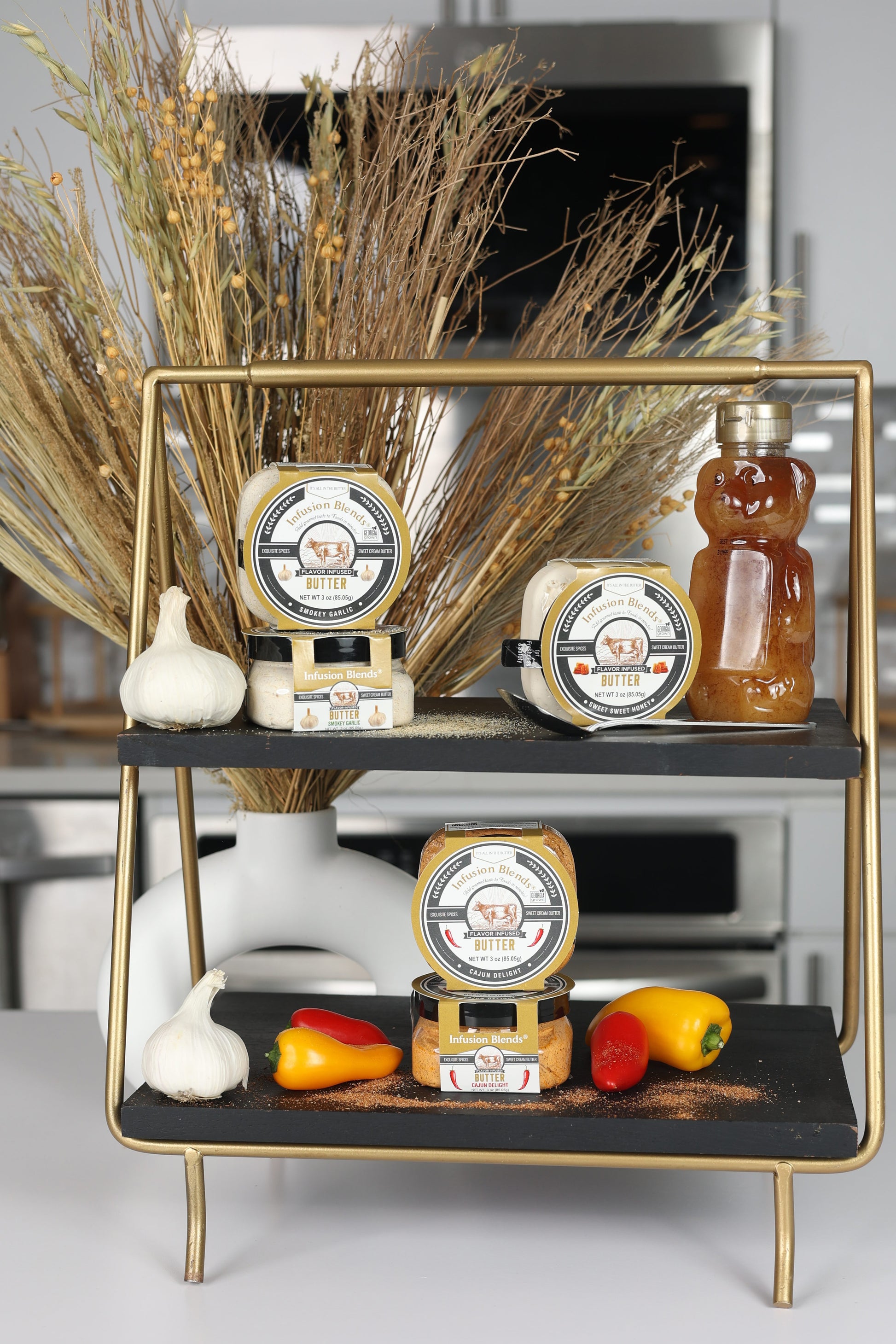 3 flavor-infused gourmet butter collection featuring garlic, Cajun, and honey butter by Infusion Blends