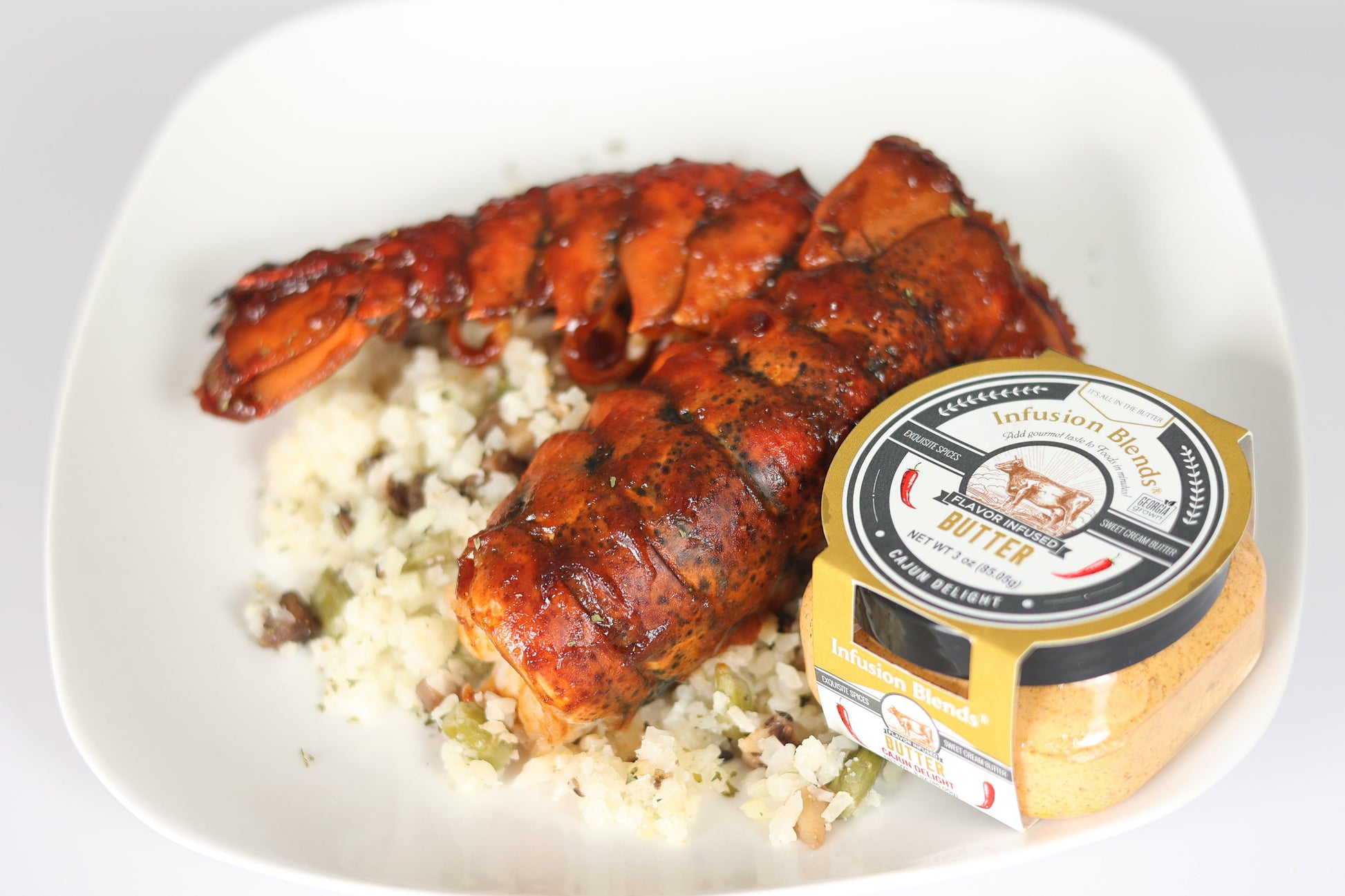 3 flavor-infused gourmet butter collection featuring garlic, Cajun, and honey butter by Infusion Blends
