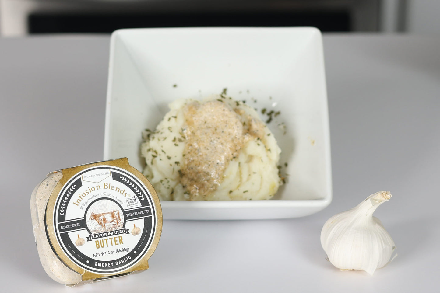 3 flavor-infused gourmet butter collection featuring garlic, Cajun, and honey butter by Infusion Blends