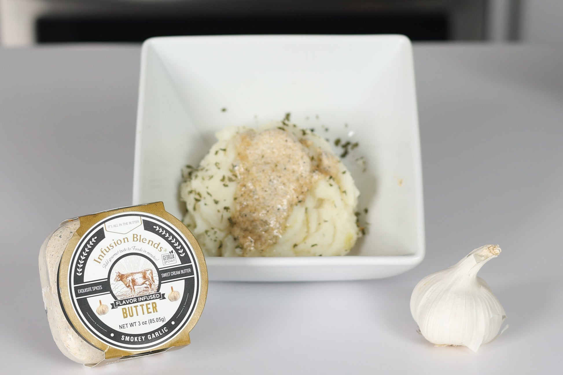 3 flavor-infused gourmet butter collection featuring garlic, Cajun, and honey butter by Infusion Blends